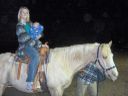 Alicia and Jared riding a horse