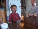 Trent blows out candles