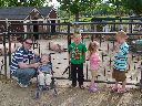 Matt with kids and a pig